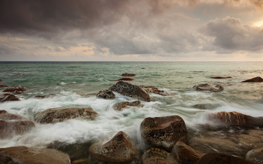 White Waves crashing on the rocks on a stormy day