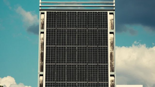 Group of large solar panels in the sunlight.