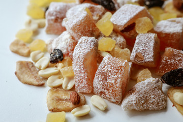 Turkish delight, nuts, dried fruits are mixed on the table