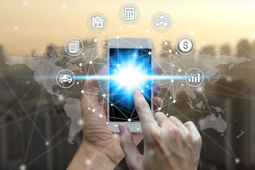 Businessman hand using smart phone the Network connection technology