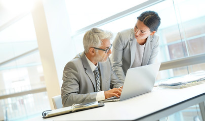 Corporate business coleagues working together in modern office