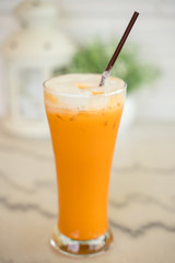 Thai milk tea in the glass with straw