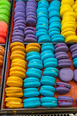 Vertical photo of multicolored macaroons cake in French patisserie 