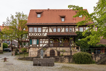 Fototapeta na wymiar Sindelfingen, Baden Wurttemberg/Germany - May 11, 2019: Traditional Half-timbered house facades in Central District Road, Hintere Gasse.
