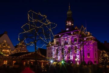 Traditional and popular Christmas market in front of the historic town hall of Lüneburg, Germany