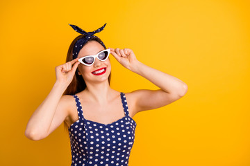 Portrait of her she nice-looking attractive lovely fascinating pretty cheerful cheery content straight-haired girl touching glasses isolated on bright vivid shine yellow background