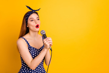 Portrait of her she nice-looking attractive lovely cheerful cheery straight-haired girl artist singing popular melody soul jazz isolated on bright vivid shine yellow background