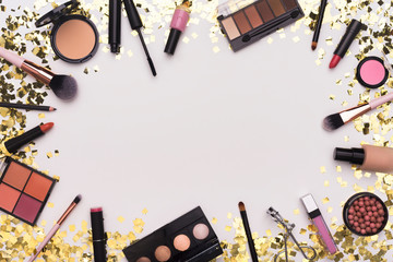 Frame of Makeup accessories, essentials and tools on white