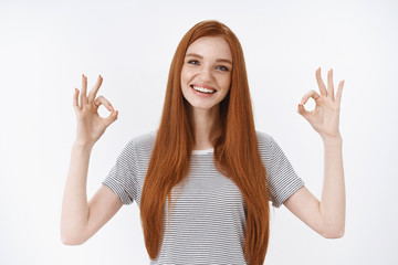 Ok affirmative. Charming tender friendly-looking cute redhead girl showing okay no problem gesture encourage friend satisfied good choice standing pleased liking awesome concept, white background