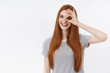 Dreamy carefree lovely outgoing redhead girl show okay perfect excellent gesture ok sign eye look through blue eyes smiling delighted express positive attitude, agree terms, white background
