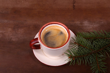 Good morning or Have a nice day Merry Christmas .Cup of coffee with cookies and fresh fir or pine branch
