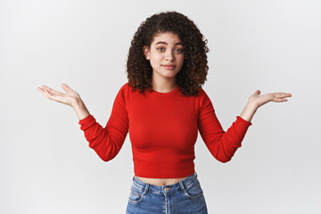 No idea. Attractive unaware questioned young unbothered relaxed female brunette shrugging helpless...