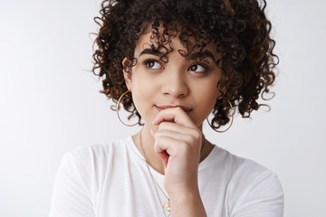 Fototapeta na wymiar Headshot thoughtful creative smart attractive curly-haired woman thinking new concept plan design look up touching lip take decision mind, recall name, remember interesting idea white background