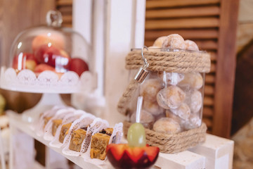 sweet festive buffet, fruit, caps, macaroni and lots of sweets