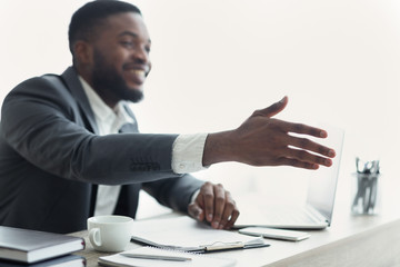 African American businessman extending hand to shake