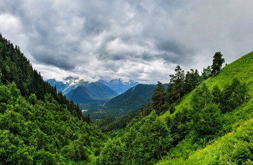 Fototapeta na wymiar caucasian mountains and cloudy sky on a summer day