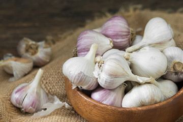 Garlic on a grey wooden table. Rustic style
