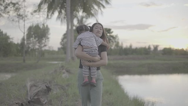 Asian moms and daughters are happily walking and enjoying outdoors. Slog3