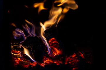 Fototapeta premium Fire is red in a closed oven on black background.