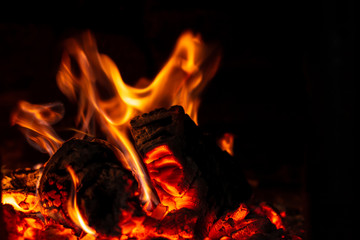 Fototapeta premium Fire is red in a closed oven on black background.