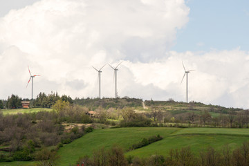 Landscape view of the Monte Galletto wind farm in Bologna Italy.  this hill is crossed by the path of the "Via degli Dei" or "The way of the Gods".