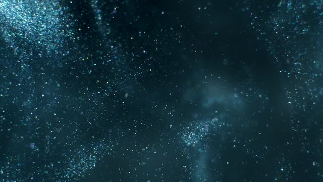 Silver ink in water Paint dropped, reacting, creating abstract cloud formations and metamorphosis on black. Art backgrounds. Slow motion. 4k