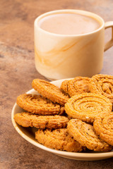 Indian Traditional Tea Time Snack Chakli, a spiral shaped crisp deep fried snack, It is known as  Chakali, Murukku, Muruku, Murkoo, Chakri in Gujarat, Chakli in Maharashtra and Northern India
