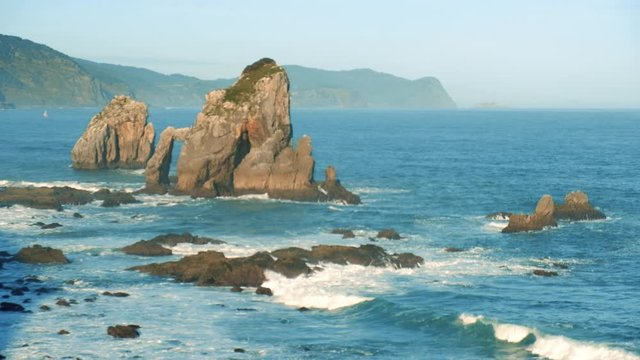 Video of sunny morning at rocky coast near San Juan de Gaztelugatxe, Spain.