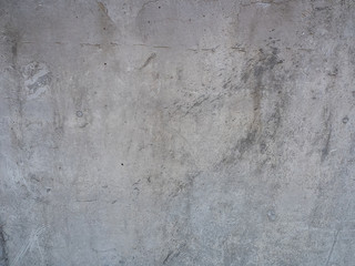 Fototapeta premium texture of gray concrete wall with scratches close up