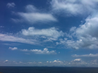 Naklejka na ściany i meble Peaceful blue sky and white clouds