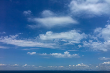 Naklejka na ściany i meble Peaceful blue sky and white clouds