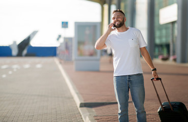 Call taxi. Man arriving at airport and ordering car