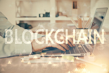 Blockchain theme hud with businessman working on computer on background. Concept of crypto chain. Double exposure.