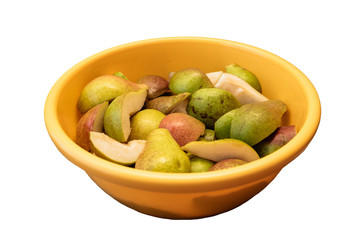 sliced pears in a yellow bowl on a white background, isolate