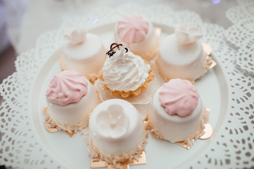 Delicious & tasty  decorated cupcakes at wedding reception closeup