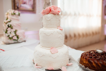 White and pink wedding cake with flowers