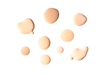 Liquid foundation swatch isolated on white background. Close Up of makeup cream sample.