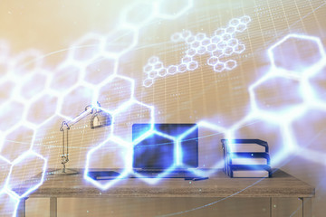 Technology theme hologram and desktop office computer background. Double exposure. Concept of high technology