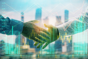 Double exposure of financial graph on cityscape background with two businessman handshake. Concept of stock market deal