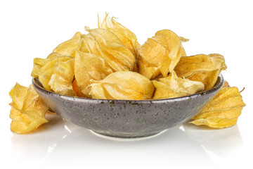 Lot of whole fresh orange physalis in dark ceramic bowl isolated on white background