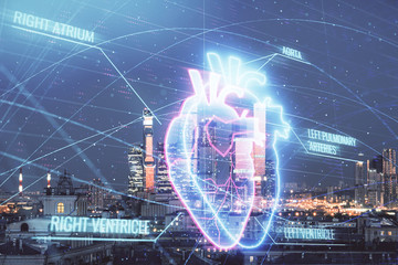 Multi exposure of human heart hologram on Moscow cityscape background. Concept of medical education