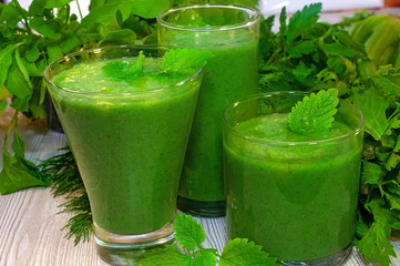 Kiwi, banana, apple and fresh greens smoothie for detox cleansing