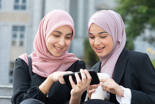 Muslim women using smart phone
