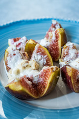 Figs with Goat Cream Cheese, Honey and Hazelnut Powder.