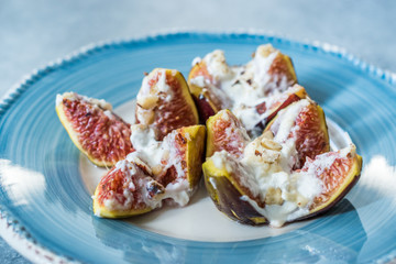 Figs with Goat Cream Cheese, Honey and Hazelnut Powder.