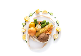 Grocery shopping with eco bag over white background. Zero waste and plastic free concept. Flat lay. Copy space.