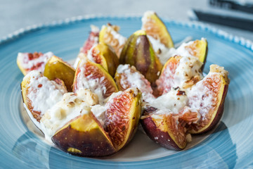 Figs with Goat Cream Cheese, Honey and Hazelnut Powder.