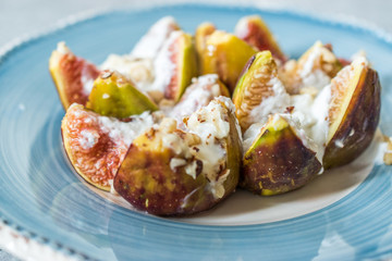 Figs with Goat Cream Cheese, Honey and Hazelnut Powder.