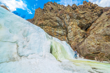 Beautiful frozen gadelsha waterfall in the southern Urals in the Republic of Bashkortostan on a...