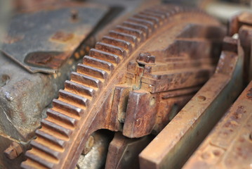 Old rusty waterwheel. Detail of the gears 